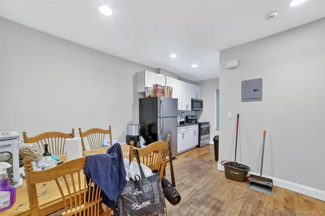 a view of a workspace with furniture and a living room