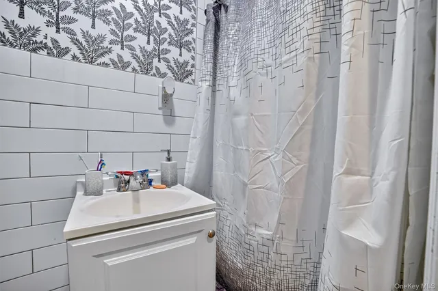 a bathroom with a sink and vanity