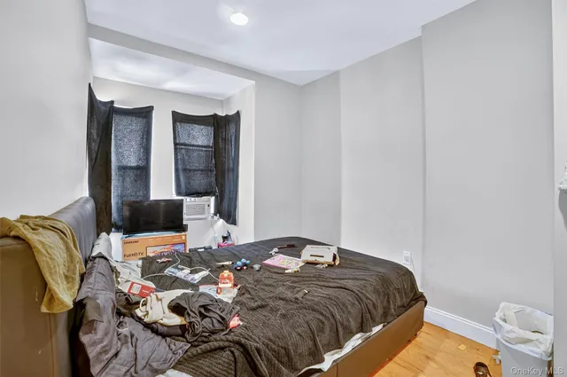 a bedroom with a bed and dresser