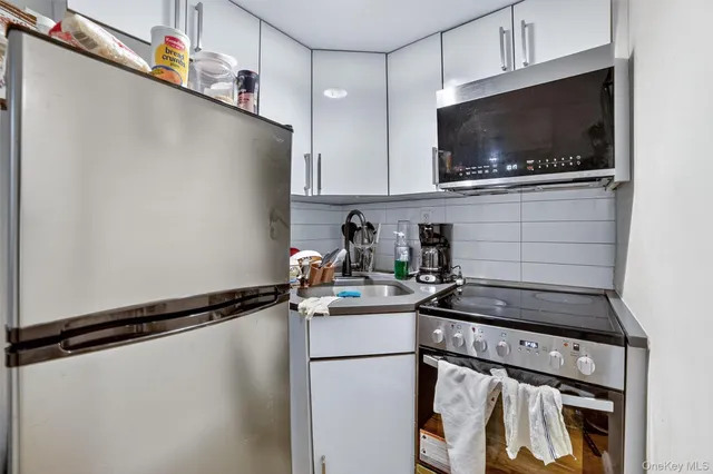 a kitchen with a stove and a microwave