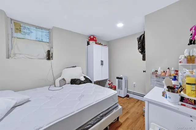 a bathroom with a toilet sink vanity and mirror