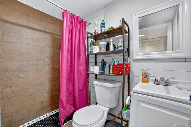 a bedroom with furniture and a chandelier