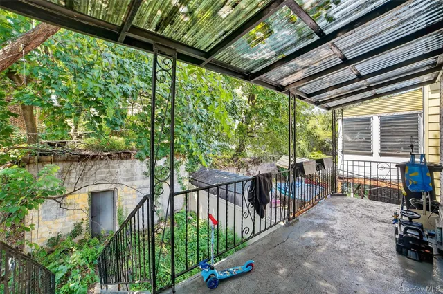a view of porch with a furniture