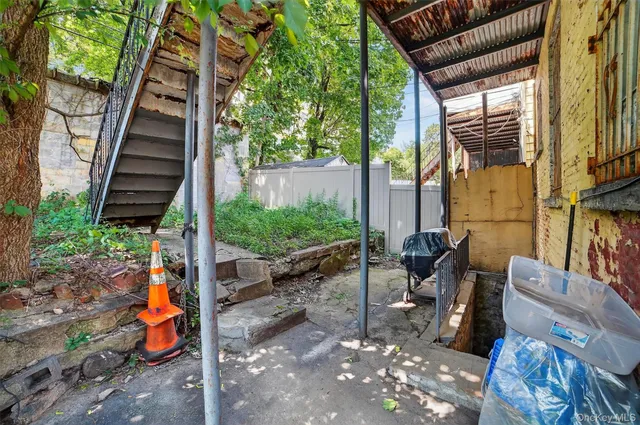 a front view of a house with wooden stairs