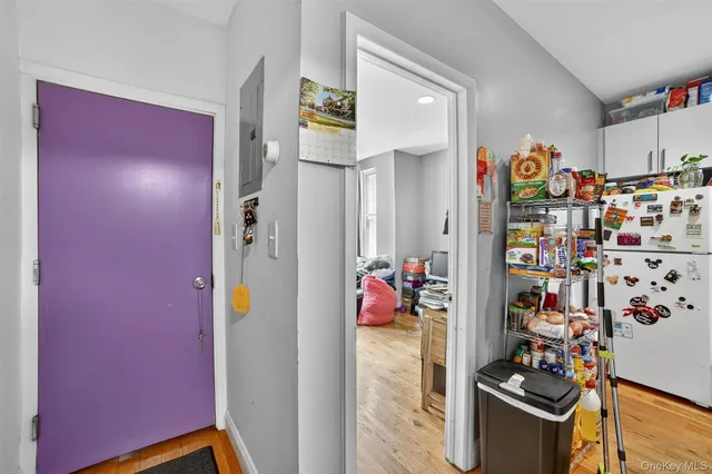 a view of a livingroom with shelves