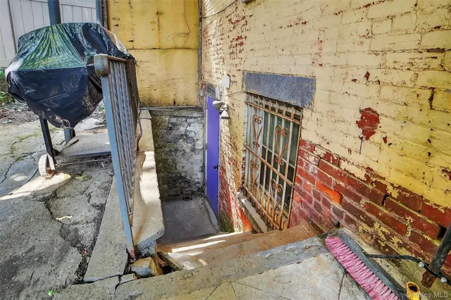 a view of a house with wooden floor and a yard
