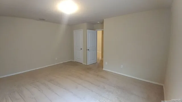 a view of a backyard with a tree