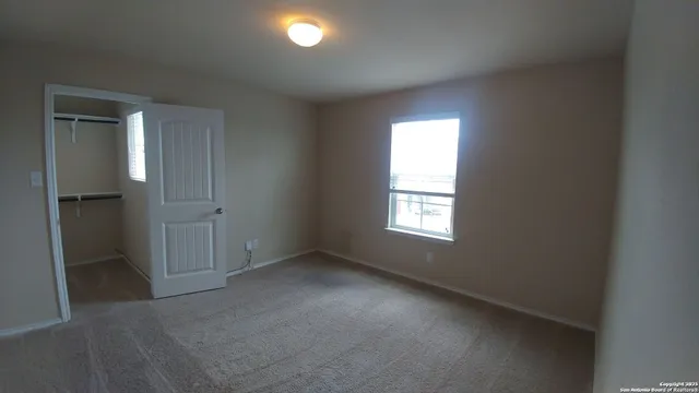 a white toilet and tub sitting next to a bathroom sink