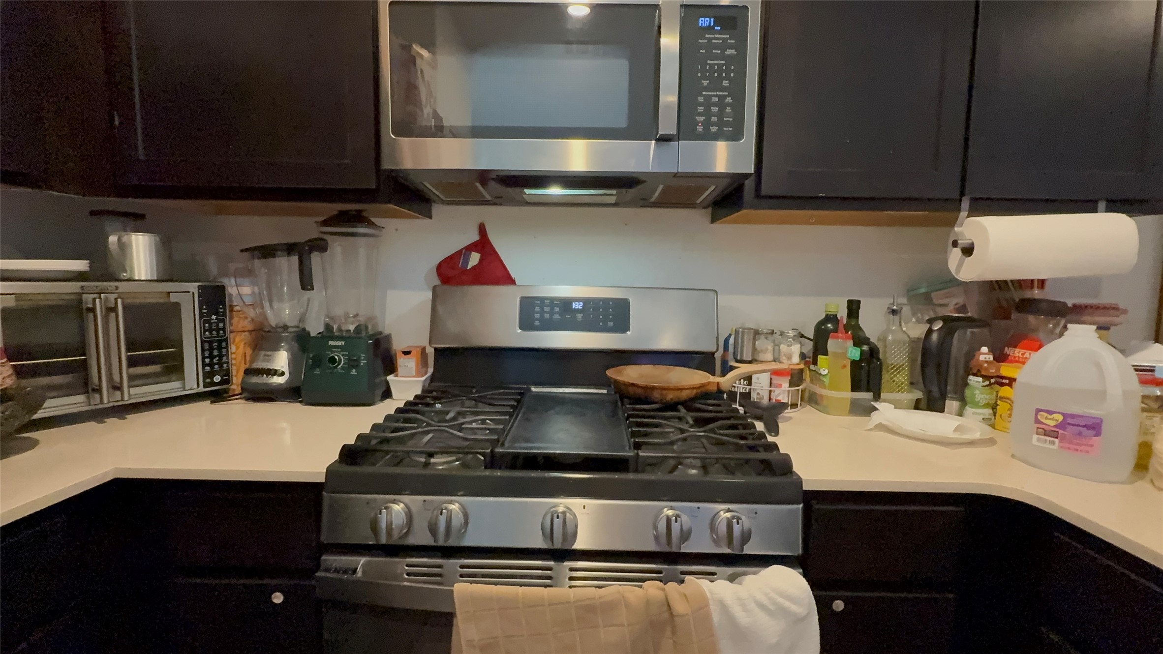 316 Geode Glen Maxwell, TX 78656 - Photo 6 of 24 a kitchen with a stove and a microwave
