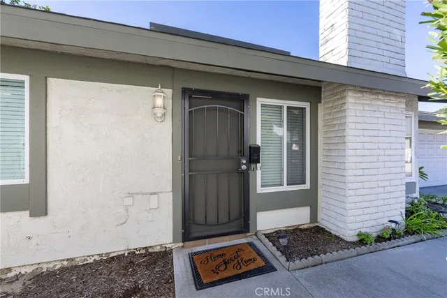 a view of a door and a window