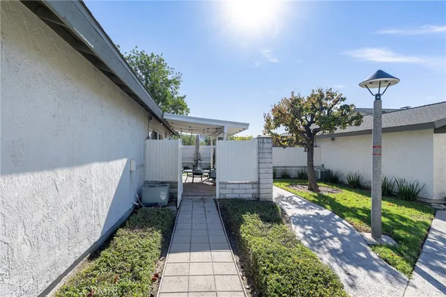 a view of a pathway with a yard
