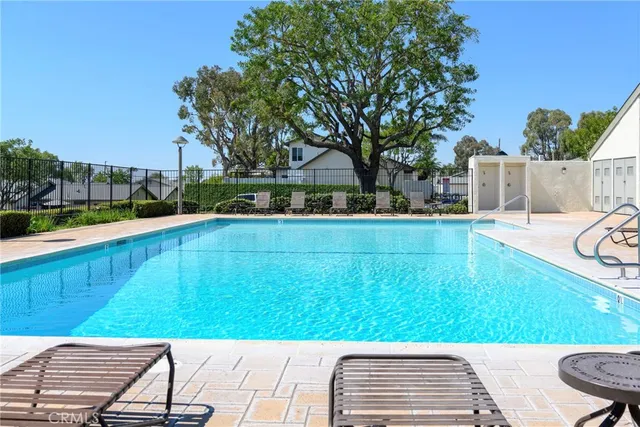 a view of a swimming pool with a patio