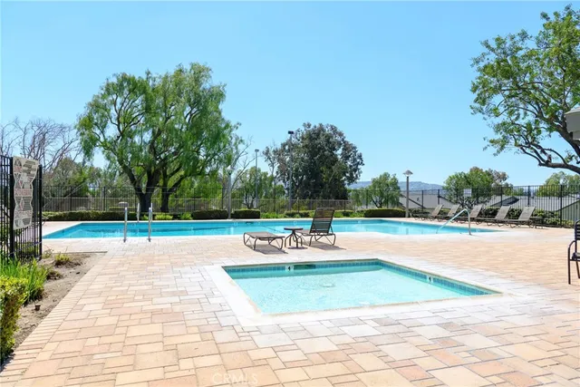 a view of a swimming pool with lounge chair