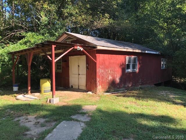 849 Fairview Road Marion, NC 28752 - Photo 13 of 15 a view of a backyard with a small cabin