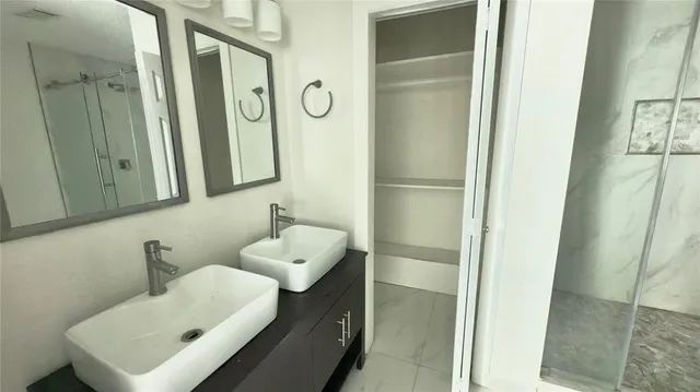 a bathroom with a sink and mirror
