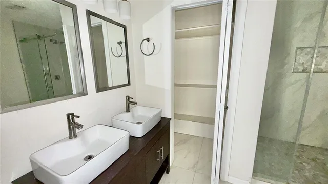 a bathroom with a sink and a mirror