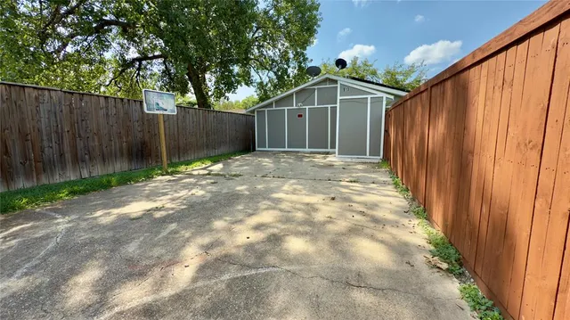 a backyard of a house with green landscape