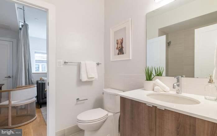 628 I Street Northeast, Unit 3 Washington, DC 20002 - Photo 19 of 32 a bathroom with a sink and a toilet