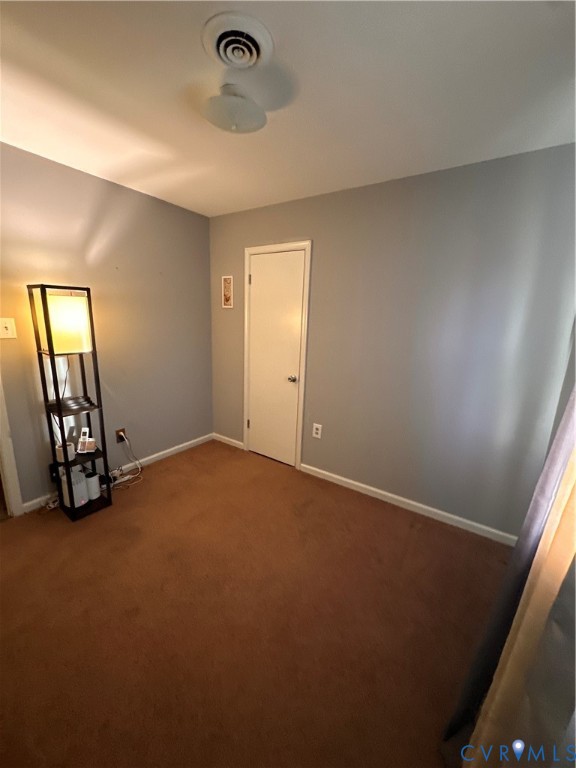 4018 Norborne Road Richmond, VA 23234 - Photo 8 of 15 Carpeted empty room featuring baseboards