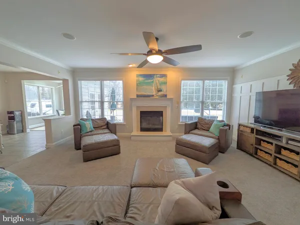 a large kitchen with white cabinets and a sink