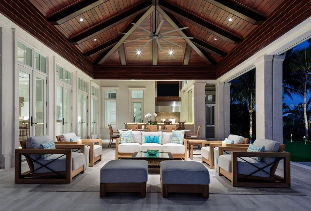 19062 Via Messina Way Miromar Lakes, FL 33913 - Photo 4 of 15 a living room with patio furniture and a large window