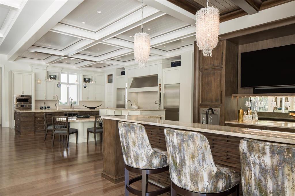19062 Via Messina Way Miromar Lakes, FL 33913 - Photo 5 of 15 a kitchen with stainless steel appliances granite countertop a table chairs a sink and a refrigerator