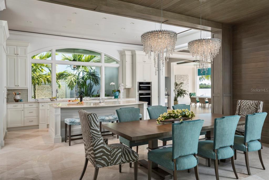 19062 Via Messina Way Miromar Lakes, FL 33913 - Photo 8 of 15 a dining room with furniture a chandelier and wooden floor
