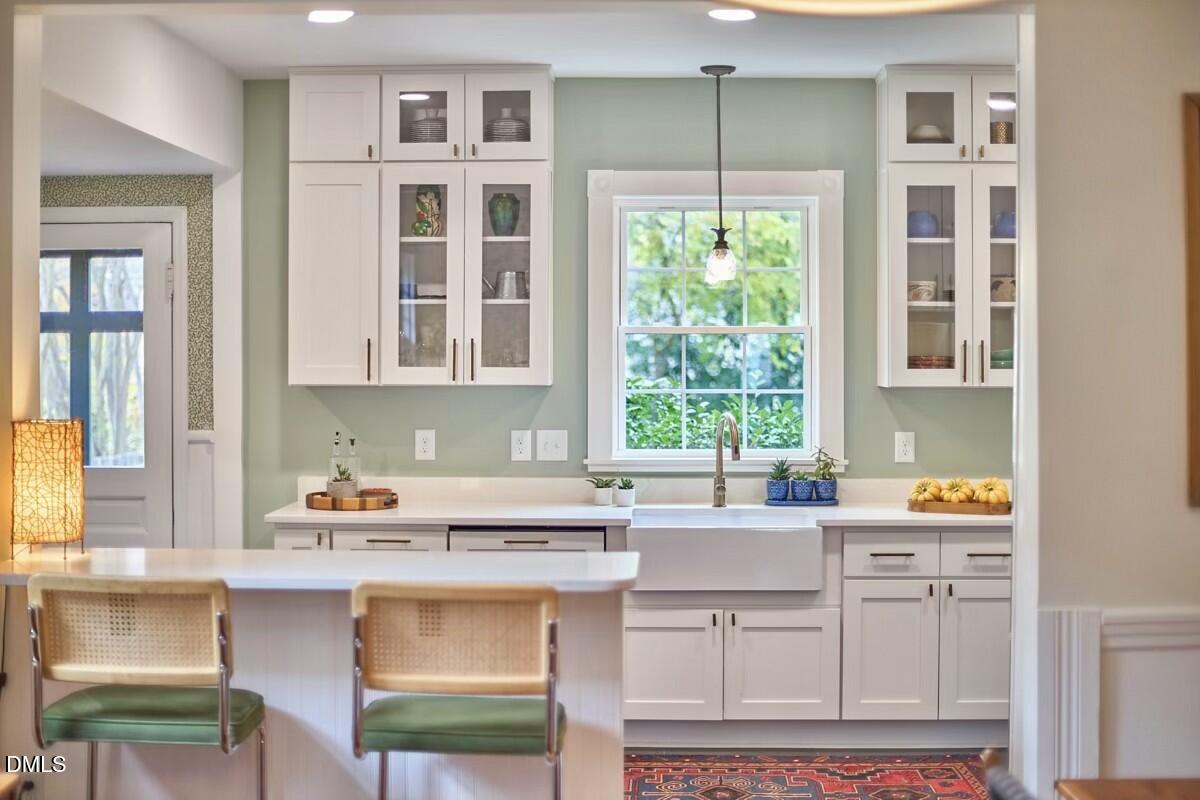 1313 Watts Street Durham, NC 27701 - Photo 18 of 44 a kitchen with a sink and a window