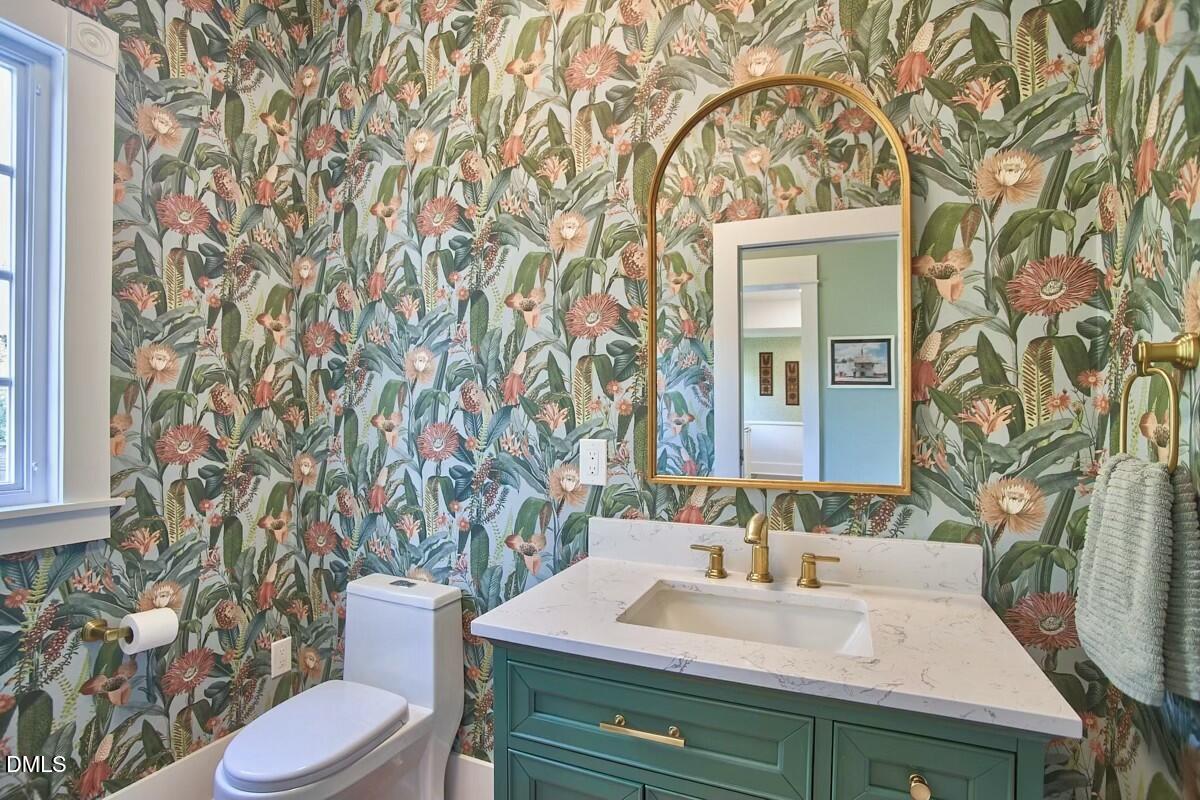 1313 Watts Street Durham, NC 27701 - Photo 24 of 44 a bathroom with a sink and a toilet