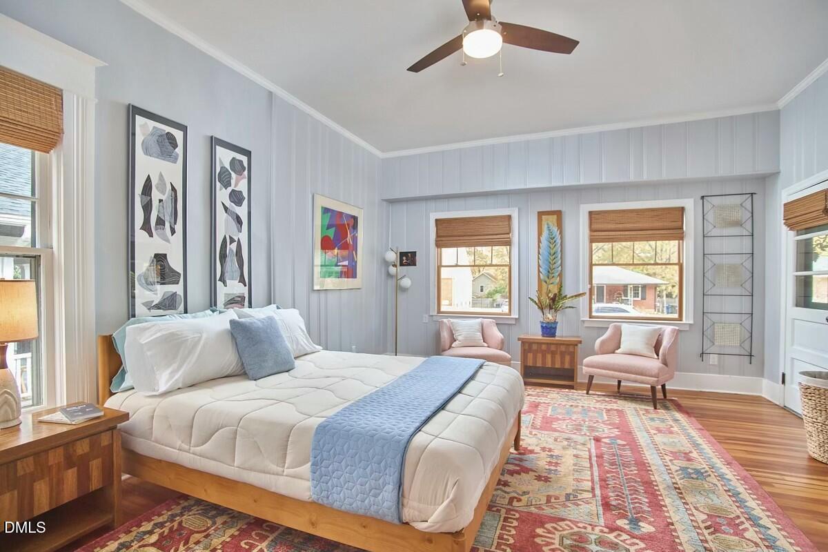 1313 Watts Street Durham, NC 27701 - Photo 28 of 44 a bedroom with a large bed couch and a window