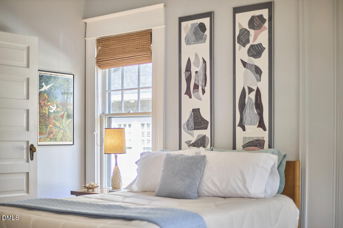 1313 Watts Street Durham, NC 27701 - Photo 31 of 44 a living room with furniture and a window
