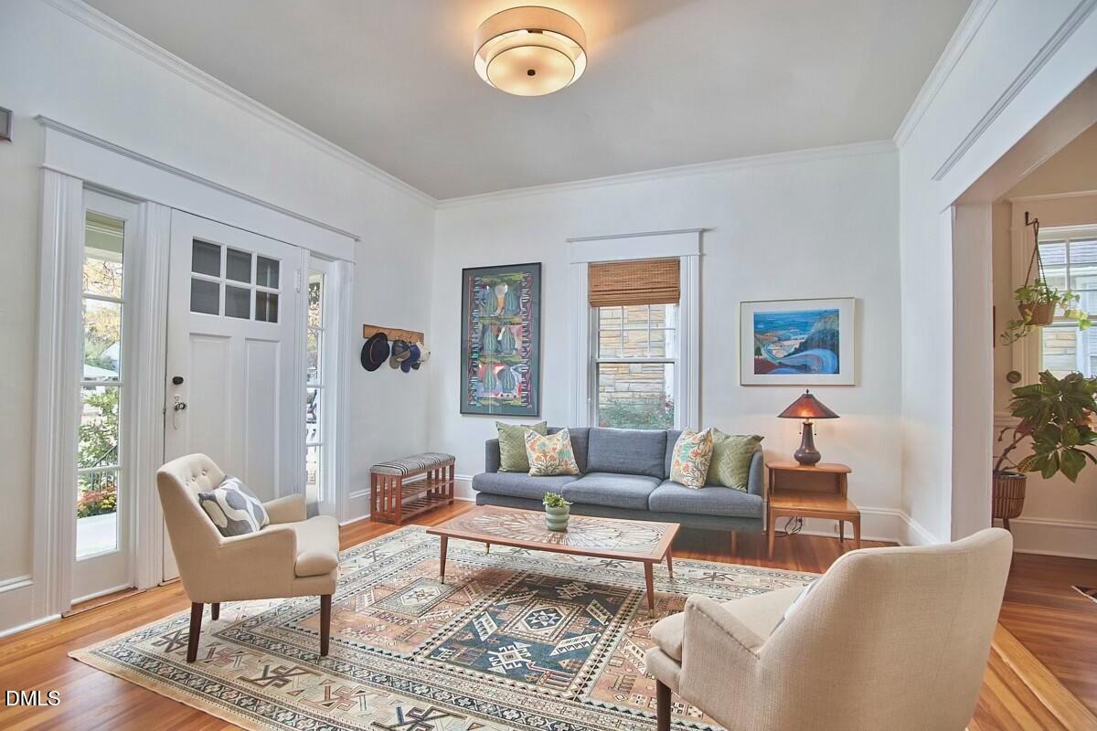 1313 Watts Street Durham, NC 27701 - Photo 6 of 44 a living room with furniture a rug and a window