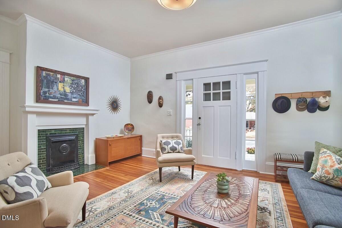 1313 Watts Street Durham, NC 27701 - Photo 7 of 44 a living room with furniture and a fireplace