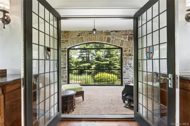 a living room with furniture and a garden