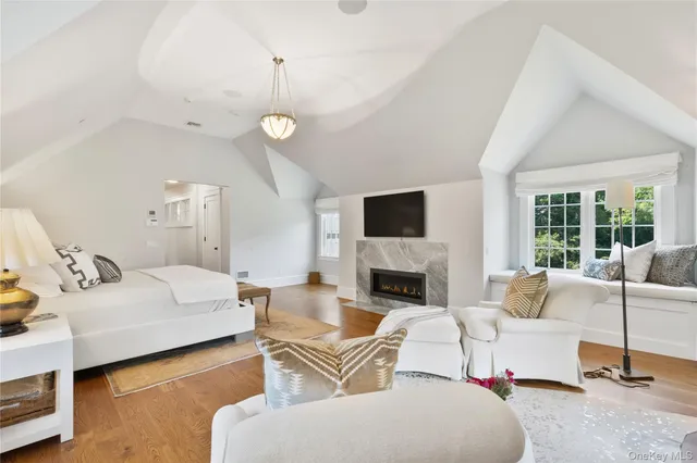 a bathroom with a shower a sink and a mirror