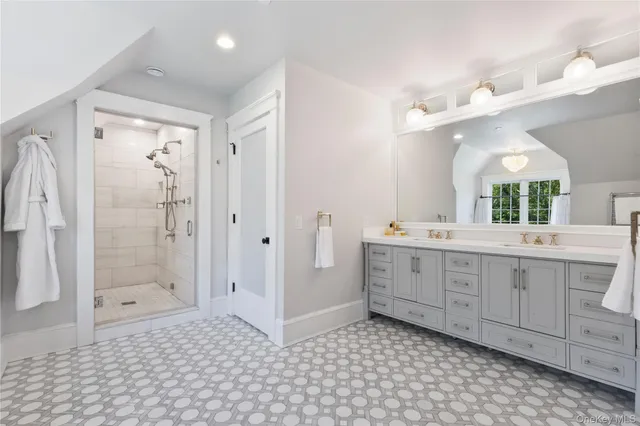 a white bath tub sitting in a bathroom next to a window