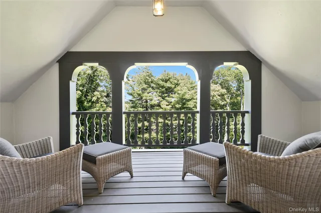 a bedroom with furniture and a wooden floor