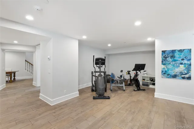 a view of a room with gym equipment and windows