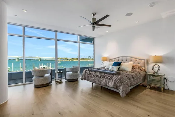 a room with a table chairs and windows