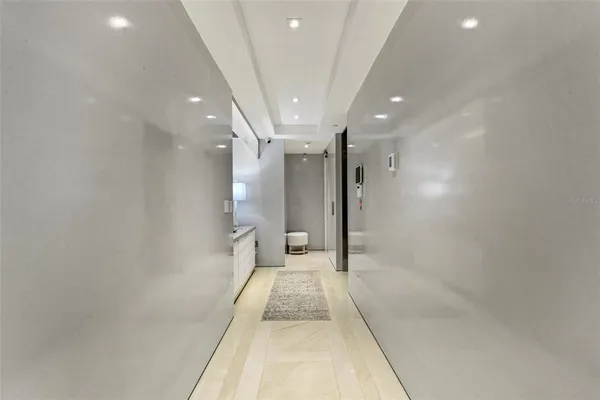 a kitchen with white cabinets and appliances