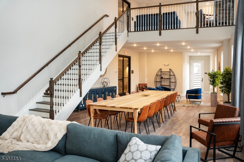 18 West Main Street, Unit 412 Bound Brook, NJ 08805 - Photo 25 of 27 a living room with furniture and a chandelier