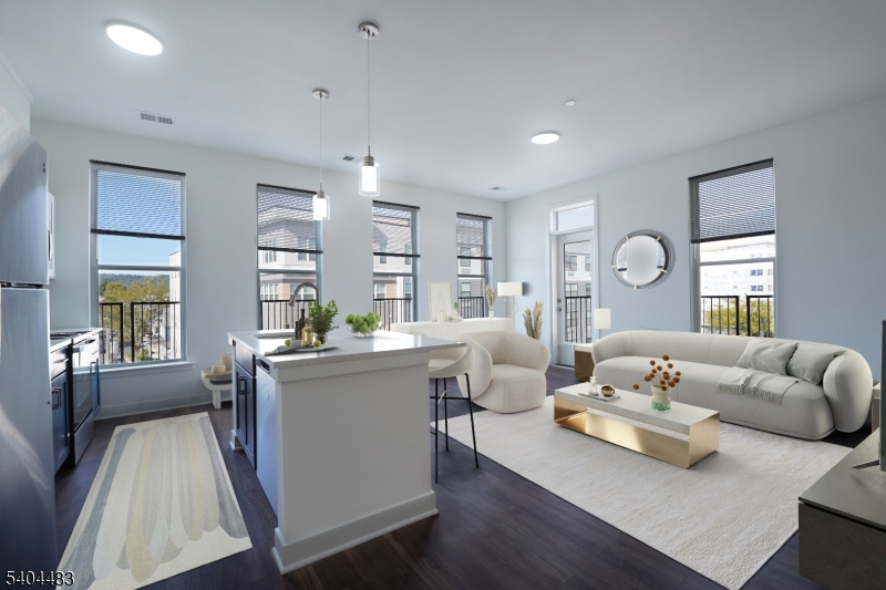 18 West Main Street, Unit 412 Bound Brook, NJ 08805 - Photo 4 of 27 a living room with furniture and a large window