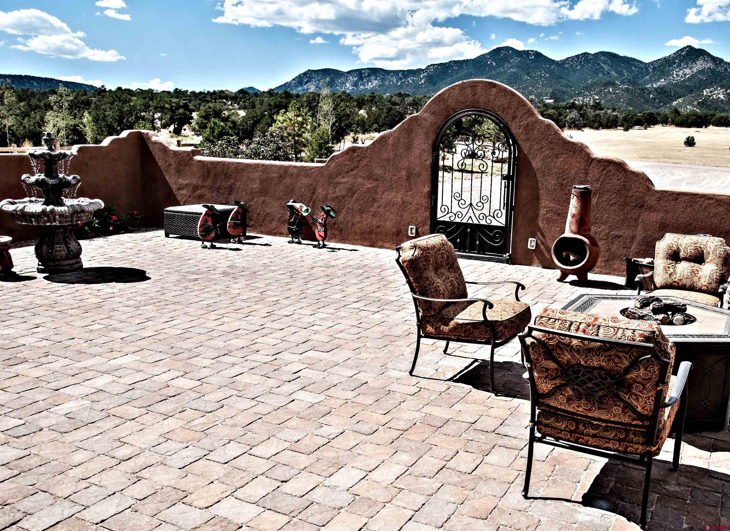 521 Dilley Ranch Road Canon City, CO 81212 - Photo 16 of 20 a view of a patio with a table and chairs