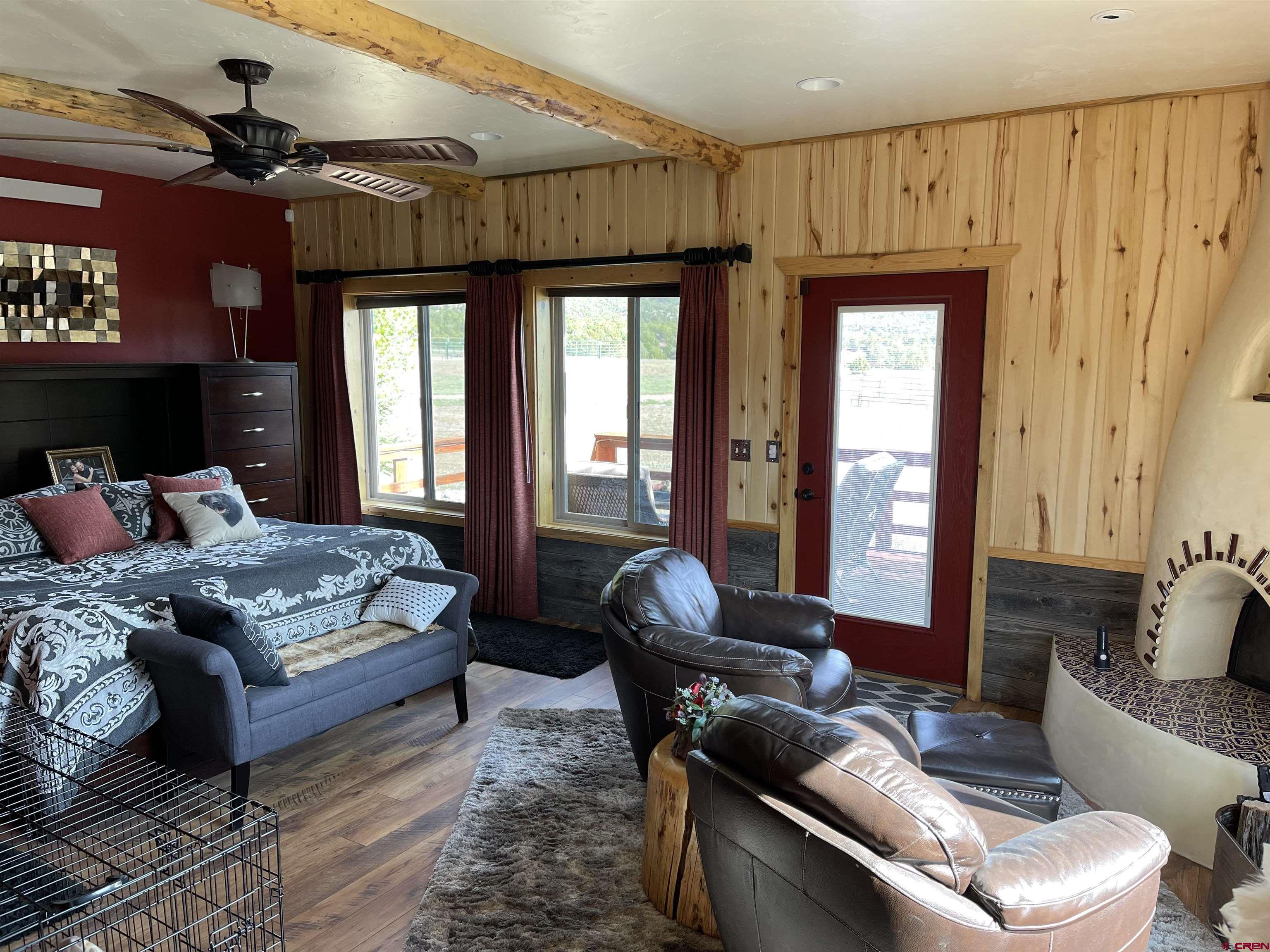 521 Dilley Ranch Road Canon City, CO 81212 - Photo 6 of 20 a bedroom with a bed and a couch
