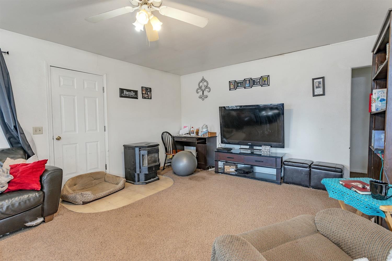 4178 Dodge Road White City, OR 97503 - Photo 15 of 35 a bedroom with furniture and a flat screen tv