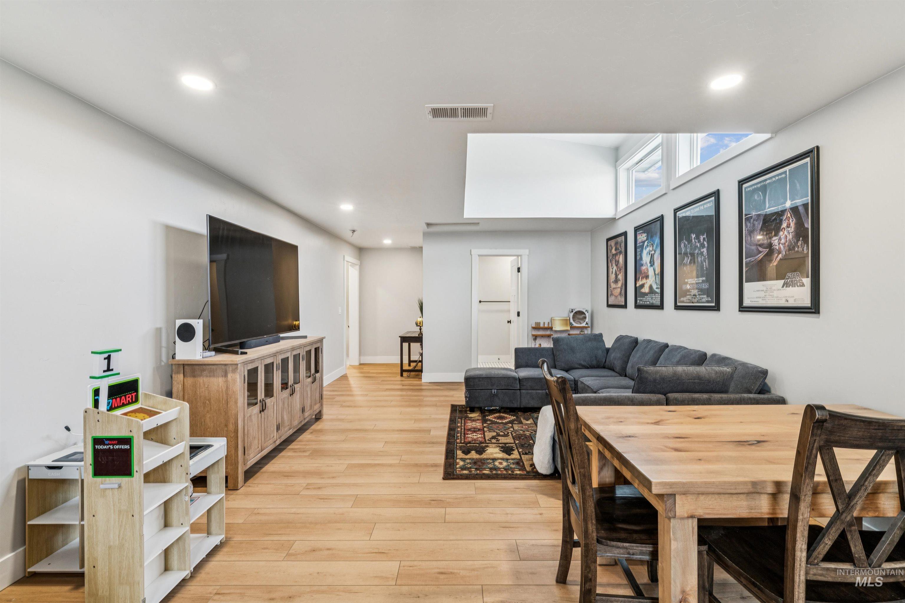 547 Bass Run Lane Marsing, ID 83639 - Photo 26 of 49 Living area with light wood-style flooring and recessed lighting