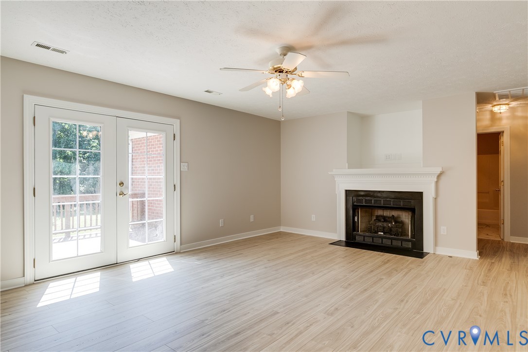 6701 Caboose Lane Sandston, VA 23150 - Photo 2 of 28 Bright and inviting living room featuring new LVP