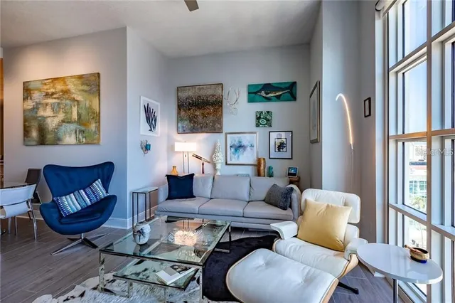 a balcony with furniture and a potted plant