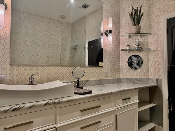 a bathroom with a sink and a mirror