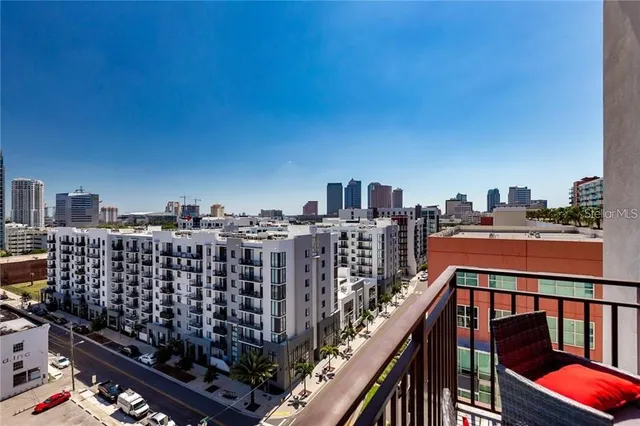 a view of a chairs and table in the balcony
